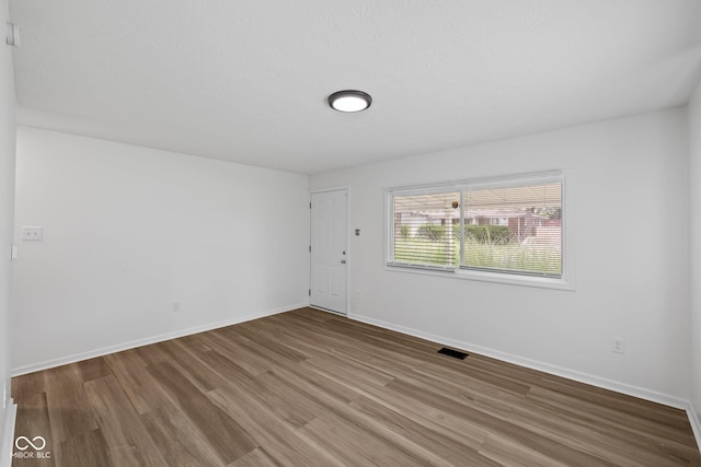 1730 S State Ave, Indianapolis, IN 46203 - empty room featuring wood finished floors and baseboards