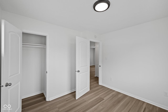 1730 S State Ave, Indianapolis, IN 46203 - unfurnished bedroom featuring wood finished floors and a closet