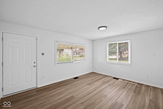 1730 S State Ave, Indianapolis, IN 46203 - empty room featuring wood finished floors and baseboards