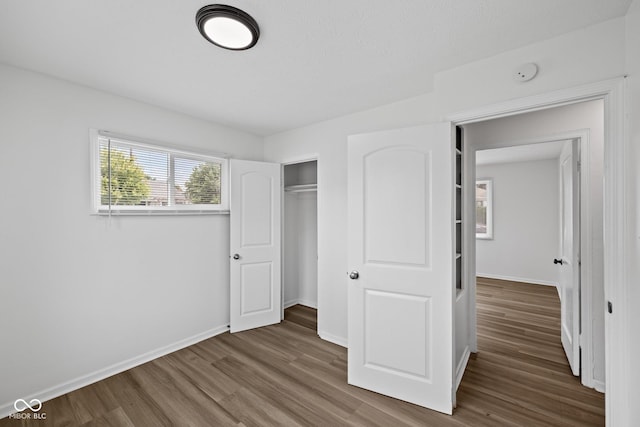 1730 S State Ave, Indianapolis, IN 46203 - unfurnished bedroom featuring wood finished floors and a closet