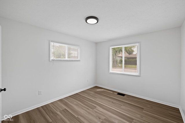 1730 S State Ave, Indianapolis, IN 46203 - unfurnished room featuring wood finished floors and baseboards
