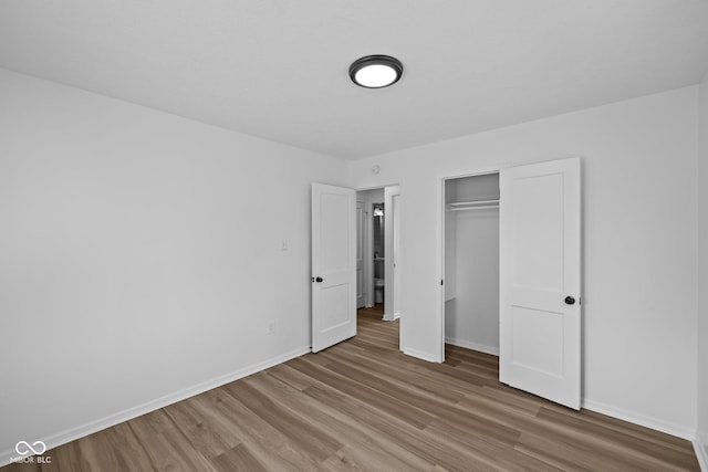 1730 S State Ave, Indianapolis, IN 46203 - unfurnished bedroom featuring wood finished floors and a closet