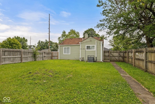 1730 S State Ave, Indianapolis, IN 46203 - rear view of property with a fenced backyard and a chimney