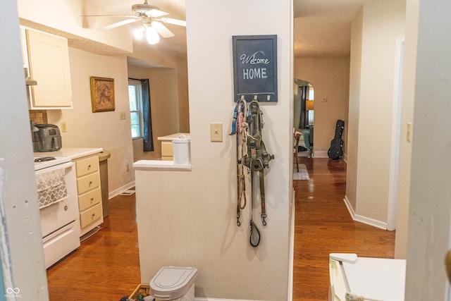 2650 S Meridian St, Indianapolis, IN 46225 - hallway featuring wood finished floors and arched walkways
