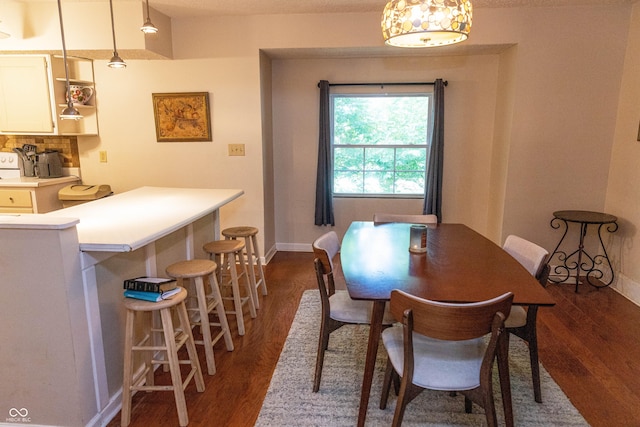 2650 S Meridian St, Indianapolis, IN 46225 - dining area featuring dark wood-style flooring and baseboards