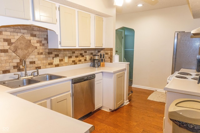 2650 S Meridian St, Indianapolis, IN 46225 - kitchen with stainless steel appliances, light wood finished floors, tasteful backsplash, light countertops, and recessed lighting