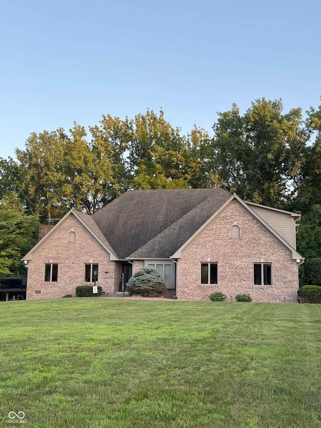 5993 E County Road 100 S, Avon, IN 46123 - view of front of house with brick siding, a front yard, and a shingled roof