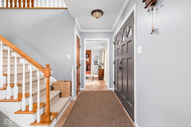 10198 N State Road 75, North Salem, IN 46165 - entrance foyer with crown molding, stairs, and wood finished floors