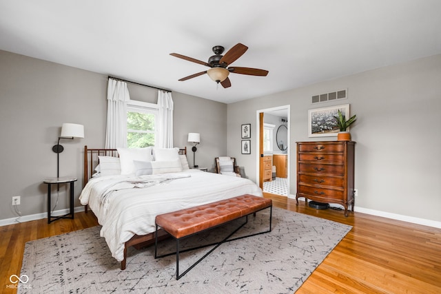 10198 N State Road 75, North Salem, IN 46165 - bedroom with wood finished floors, ceiling fan, and ensuite bathroom
