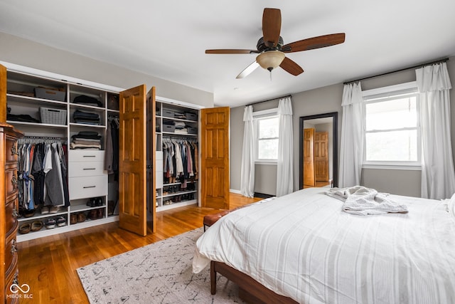 10198 N State Road 75, North Salem, IN 46165 - bedroom featuring wood finished floors, two closets, and ceiling fan