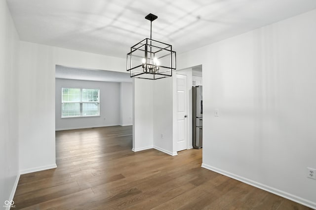 13264 Penneagle Dr, Carmel, IN 46033 - unfurnished dining area featuring a chandelier and dark wood-type flooring