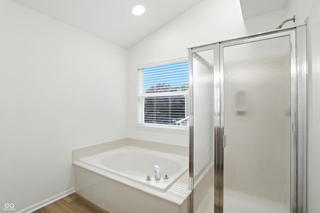13264 Penneagle Dr, Carmel, IN 46033 - full bathroom featuring lofted ceiling, a stall shower, a garden tub, and wood finished floors