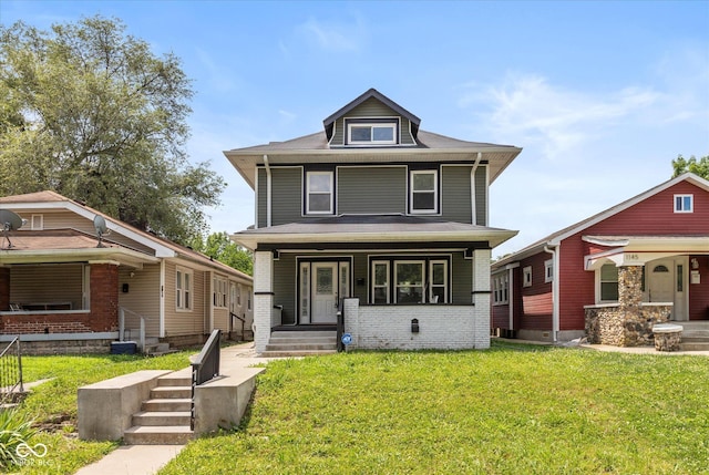 1141 W 35th St, Indianapolis, IN 46208 - american foursquare style home with a porch and a front yard