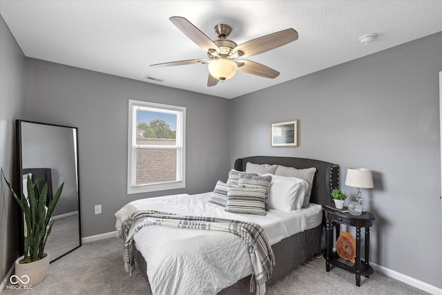 1141 W 35th St, Indianapolis, IN 46208 - bedroom with light colored carpet and ceiling fan