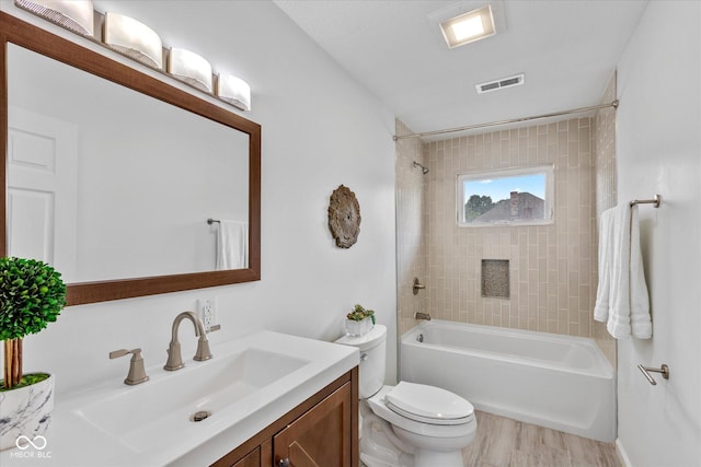 1141 W 35th St, Indianapolis, IN 46208 - bathroom featuring vanity, shower / tub combination, and wood finished floors