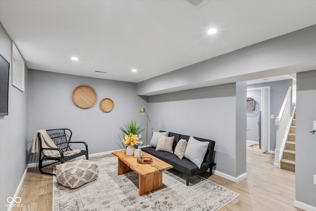 1141 W 35th St, Indianapolis, IN 46208 - living area featuring light wood-style flooring, recessed lighting, and stairway