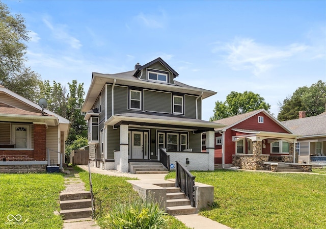 1141 W 35th St, Indianapolis, IN 46208 - american foursquare style home featuring a porch, a front lawn, and a chimney