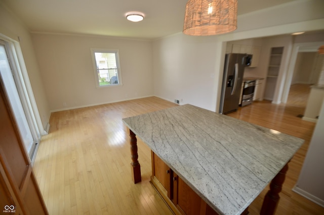 4930 Primrose Ave N, Indianapolis, IN 46205 - dining room featuring light wood-type flooring and ornamental molding
