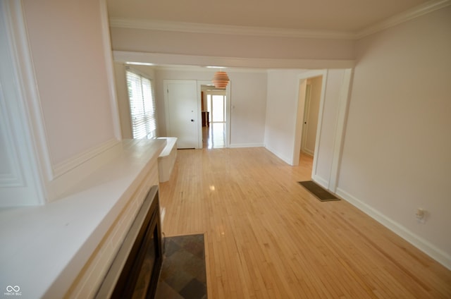 4930 Primrose Ave N, Indianapolis, IN 46205 - hall with light wood finished floors and crown molding