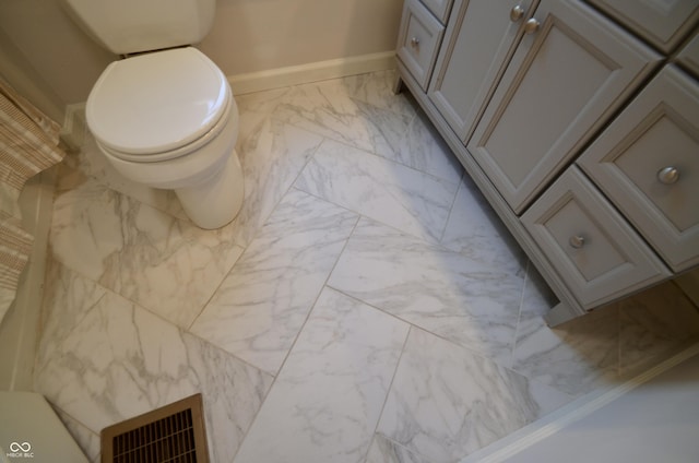 4930 Primrose Ave N, Indianapolis, IN 46205 - bathroom with marble finish floors and toilet