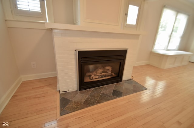 4930 Primrose Ave N, Indianapolis, IN 46205 - detailed view of wood finished floors and a tile fireplace