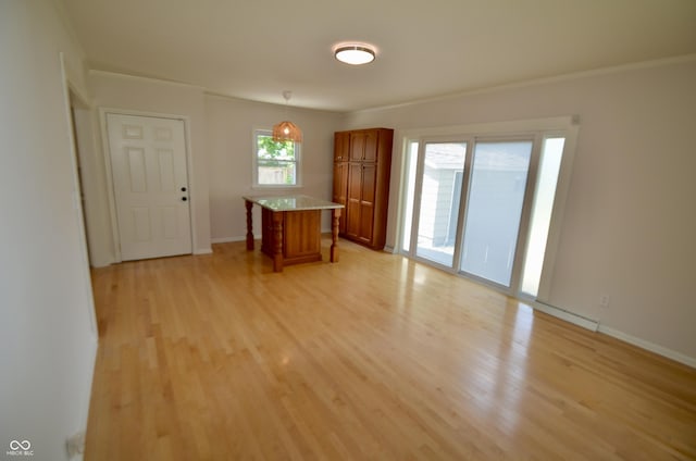 4930 Primrose Ave N, Indianapolis, IN 46205 - empty room featuring light wood-type flooring and ornamental molding