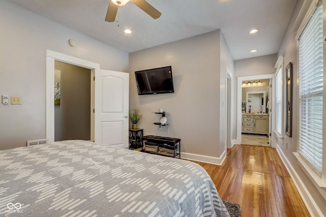 2332 Central Ave, Indianapolis, IN 46205 - bedroom with light wood-style flooring, recessed lighting, a ceiling fan, and ensuite bath