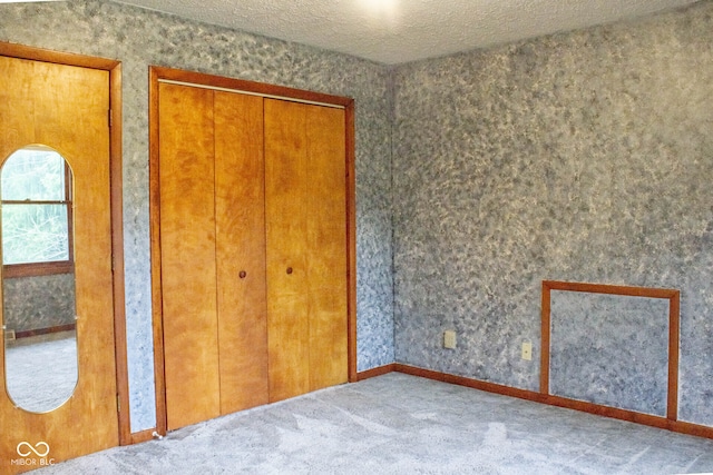 3401 N 75 W, Cayuga, IN 47928 - unfurnished bedroom with carpet floors and a textured ceiling