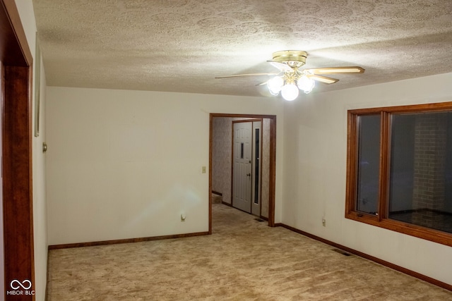 3401 N 75 W, Cayuga, IN 47928 - empty room featuring light colored carpet, ceiling fan, and a textured ceiling