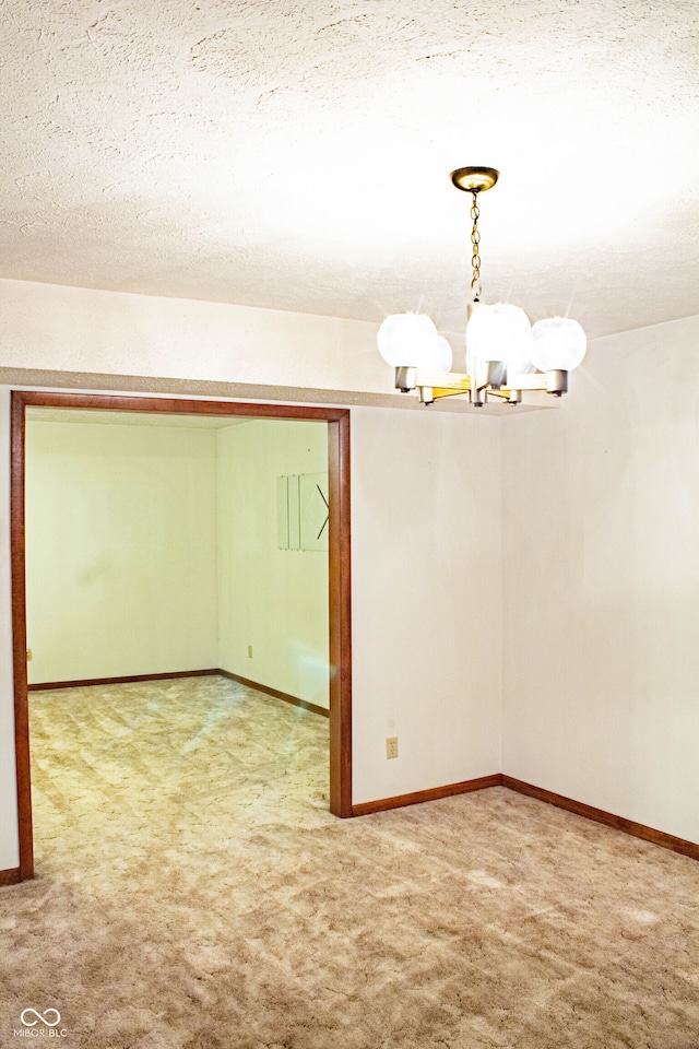 3401 N 75 W, Cayuga, IN 47928 - unfurnished room with a chandelier, carpet floors, and a textured ceiling