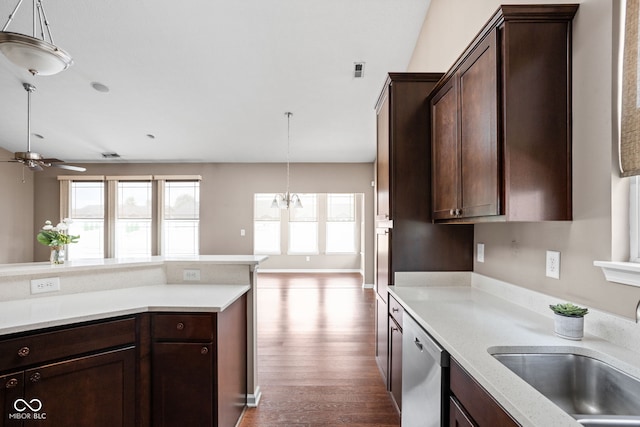 1418 Blackthorne Trl S, Plainfield, IN 46168 - kitchen with stainless steel dishwasher, ceiling fan, light countertops, wood finished floors, and dark brown cabinets