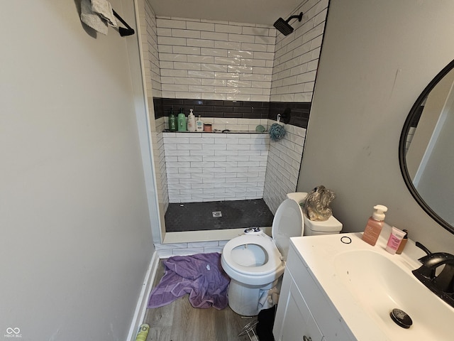 3836 N Wittfield St, Indianapolis, IN 46235 - full bathroom featuring a stall shower, vanity, and wood finished floors
