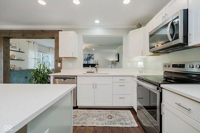 6036 W Bayfront Shrs, Mccordsville, IN 46055 - kitchen with appliances with stainless steel finishes, light countertops, dark wood-style floors, white cabinets, and recessed lighting