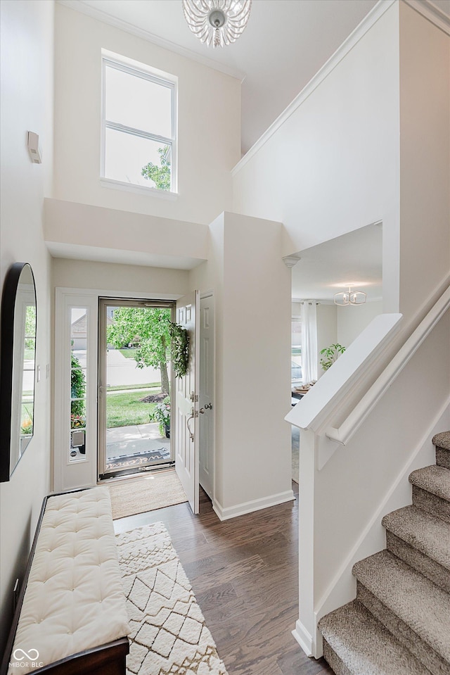 6036 W Bayfront Shrs, Mccordsville, IN 46055 - entrance foyer with a chandelier, stairs, a towering ceiling, and wood finished floors