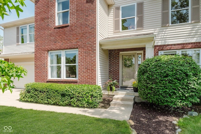 6036 W Bayfront Shrs, Mccordsville, IN 46055 - property entrance featuring brick siding and a garage