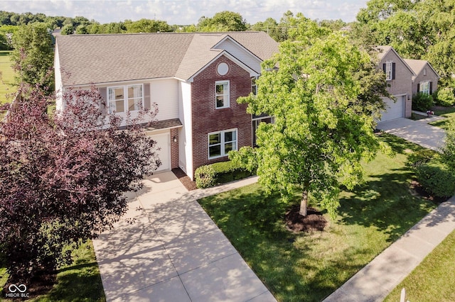 6036 W Bayfront Shrs, Mccordsville, IN 46055 - traditional home with driveway, an attached garage, a front yard, brick siding, and roof with shingles
