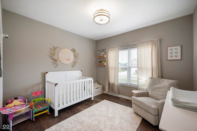 6420 Colt Ln, Anderson, IN 46013 - bedroom with a nursery area and wood finished floors