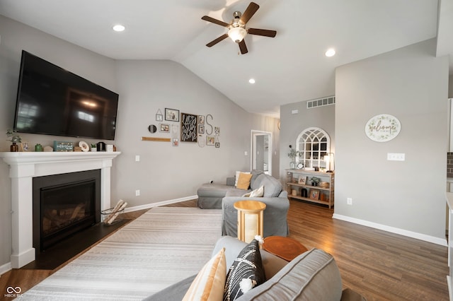 6420 Colt Ln, Anderson, IN 46013 - living area featuring ceiling fan, lofted ceiling, a fireplace with flush hearth, wood finished floors, and recessed lighting