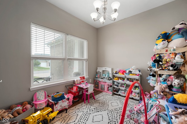 6420 Colt Ln, Anderson, IN 46013 - recreation room with a chandelier and wood finished floors