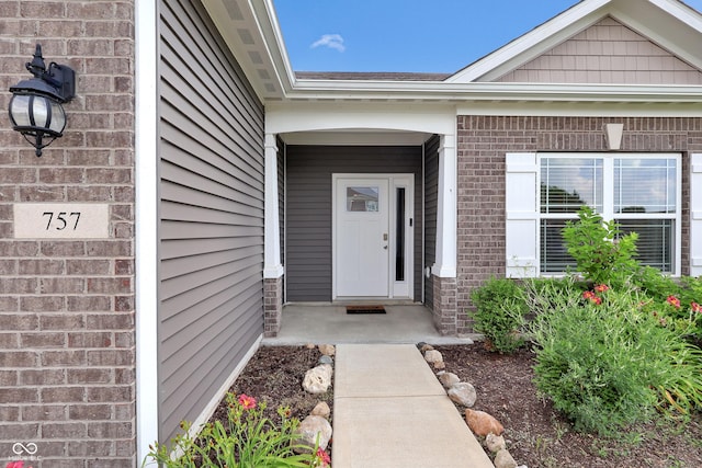 757 Carson Ln, Greenfield, IN 46140 - doorway to property with brick siding and a porch