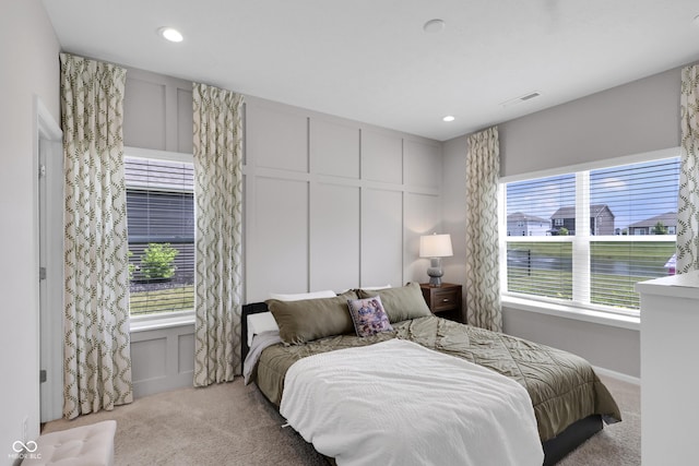 757 Carson Ln, Greenfield, IN 46140 - carpeted bedroom with a decorative wall, multiple windows, and recessed lighting