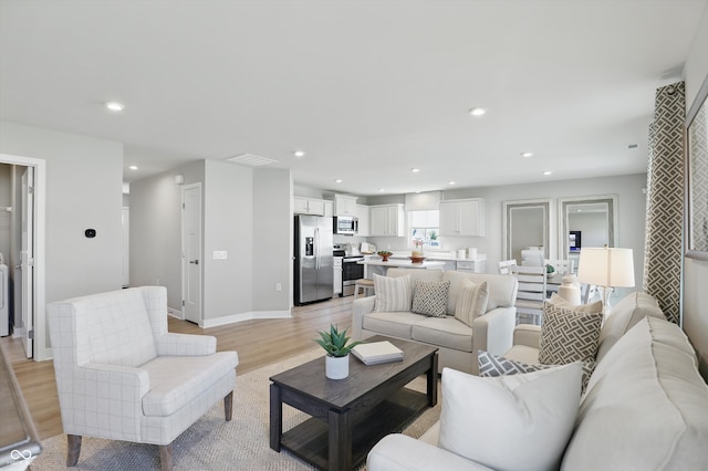 4182 Hume Ave, Plainfield, IN 46168 - living area featuring light wood finished floors and recessed lighting
