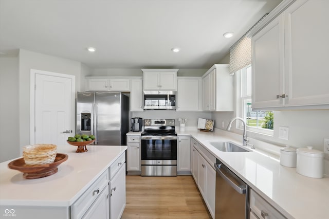 4182 Hume Ave, Plainfield, IN 46168 - kitchen featuring appliances with stainless steel finishes, light countertops, white cabinets, recessed lighting, and light wood-style floors