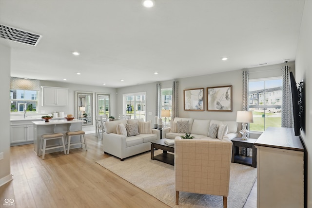 4182 Hume Ave, Plainfield, IN 46168 - living area with light wood finished floors, plenty of natural light, and recessed lighting
