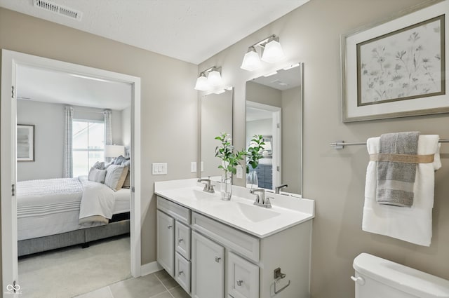 4182 Hume Ave, Plainfield, IN 46168 - ensuite bathroom featuring double vanity and tile patterned floors