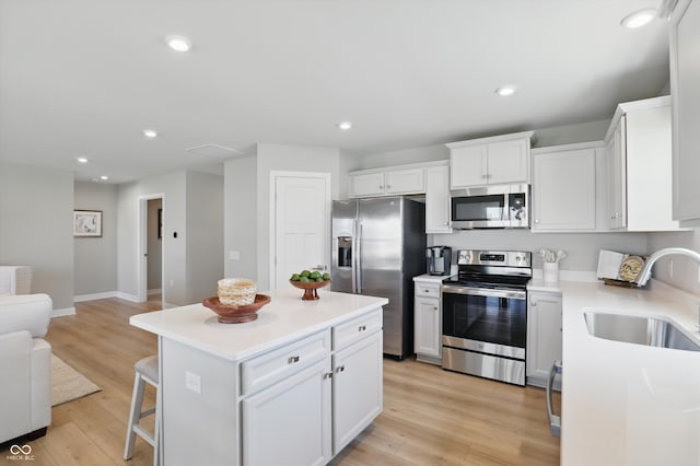 4182 Hume Ave, Plainfield, IN 46168 - kitchen with appliances with stainless steel finishes, open floor plan, white cabinetry, light countertops, and recessed lighting