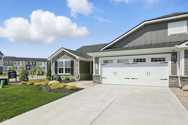 4182 Hume Ave, Plainfield, IN 46168 - view of front of house featuring board and batten siding, stone siding, driveway, and a shingled roof