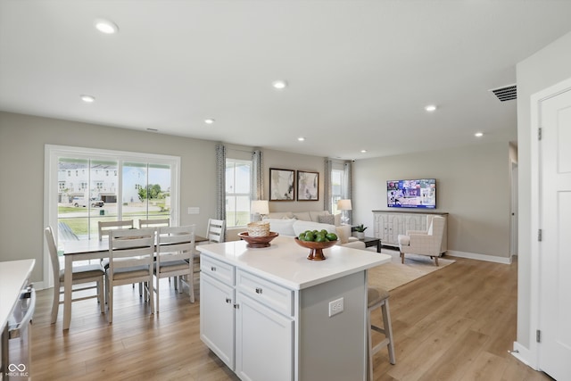 4182 Hume Ave, Plainfield, IN 46168 - kitchen featuring a kitchen island, recessed lighting, light wood-style floors, white cabinets, and open floor plan