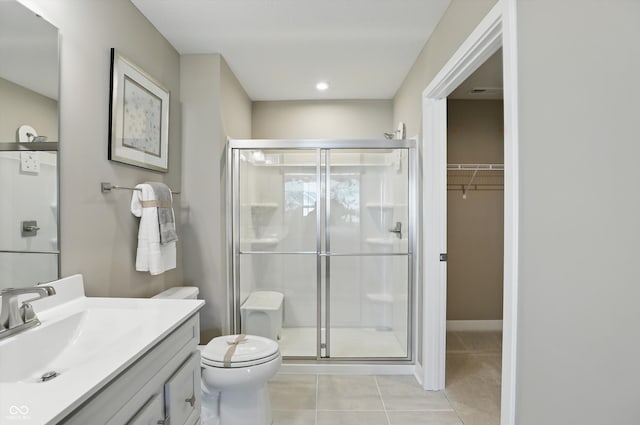 4182 Hume Ave, Plainfield, IN 46168 - full bath featuring a stall shower, vanity, tile patterned floors, and a walk in closet