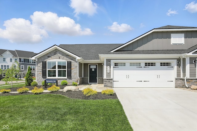 4182 Hume Ave, Plainfield, IN 46168 - craftsman-style house featuring stone siding, board and batten siding, a front yard, and a shingled roof